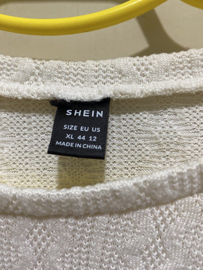SHEIN White Textured Cropped Top (Category: Blouses) located in Pasig City. Submitted by alaineeeee (Listing ID 1462770418, Image 2). Description: - White textured cropped top from SHEIN - Features a cable knit pattern all over - Short sleeves and relaxed fit for comfort - Stylish and versatile for casual wear - Easily pairs with jeans or skirts.