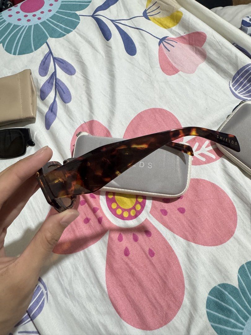 SHIELDS by EO Tortoiseshell Sunglasses with Case (Category: Sunglasses & Eyewear) located in Manila. Submitted by chie04_875 (Listing ID 1462859493, Image 2). Description: - Brand: SHIELDS - Style: Sunglasses - Pattern: Cool Tortoiseshell - Lens Color: Yellow/Orange Tint - Includes: Original SHIELDS Case - Ideal for: Sunny days.