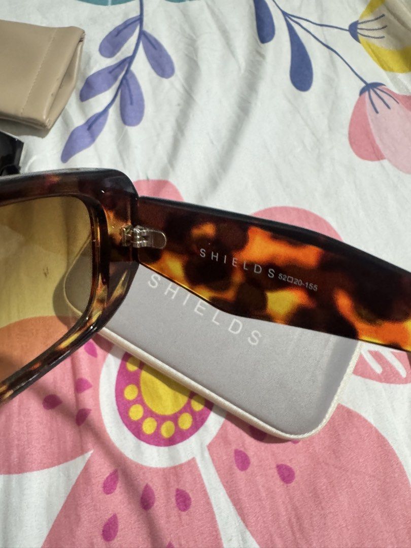 SHIELDS by EO Tortoiseshell Sunglasses with Case (Category: Sunglasses & Eyewear) located in Manila. Submitted by chie04_875 (Listing ID 1462859493, Image 3). Description: - Brand: SHIELDS - Style: Sunglasses - Pattern: Cool Tortoiseshell - Lens Color: Yellow/Orange Tint - Includes: Original SHIELDS Case - Ideal for: Sunny days.