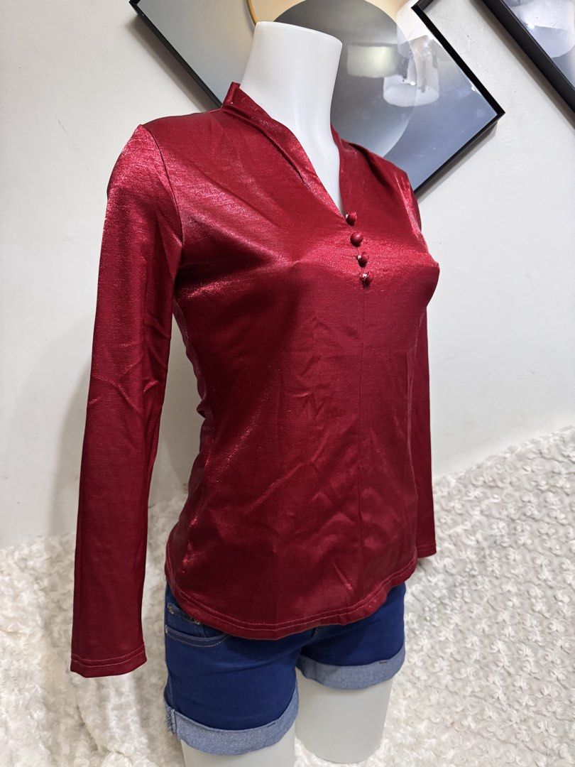 Shiny Red Long Sleeve Blouse with Button Detail (Category: Blouses) located in Marikina City. Submitted by lorradel (Listing ID 1462724805, Image 2). Description: - fits XS-S - Eye-catching red long sleeve blouse - Elegant mandarin collar - Three functional buttons down the front - Luxurious fabric with a subtle, shiny finish - Perfect for dressing up or down - Ideal for night outs or stylish daytime wear - Comfortable and chic design - MAY HAVE 