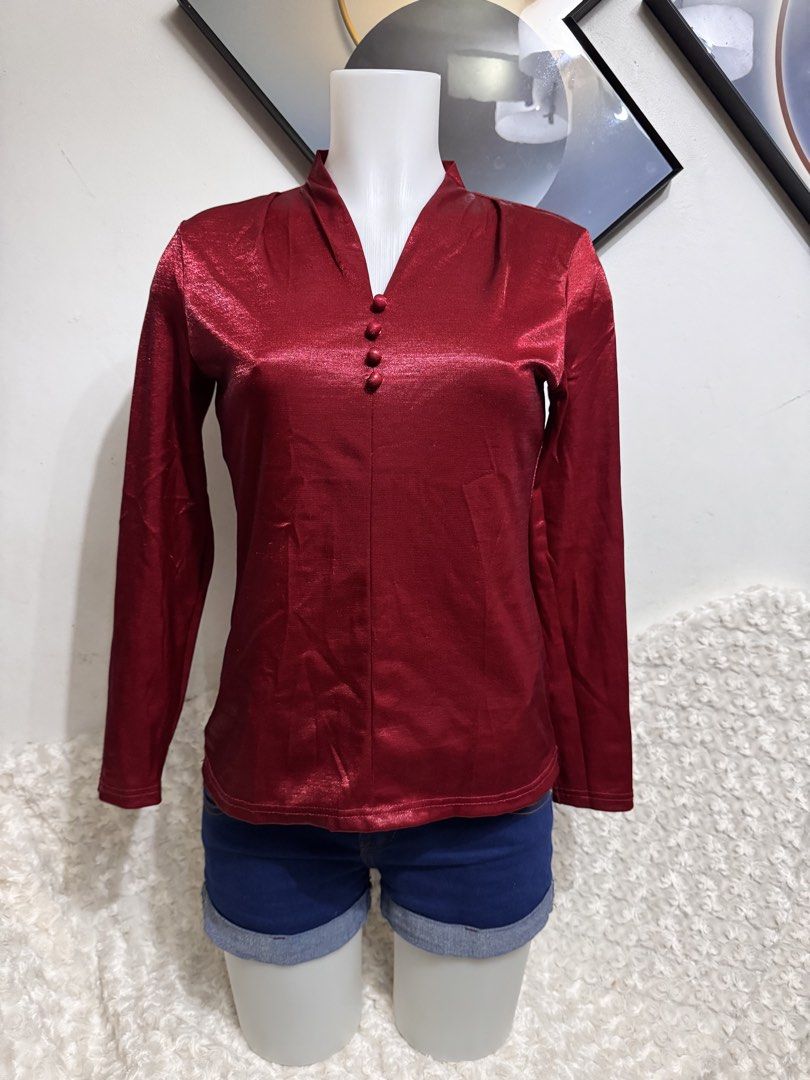 Shiny Red Long Sleeve Blouse with Button Detail (Category: Blouses) located in Marikina City. Submitted by lorradel (Listing ID 1462724805, Image 1). Description: - fits XS-S - Eye-catching red long sleeve blouse - Elegant mandarin collar - Three functional buttons down the front - Luxurious fabric with a subtle, shiny finish - Perfect for dressing up or down - Ideal for night outs or stylish daytime wear - Comfortable and chic design - MAY HAVE 