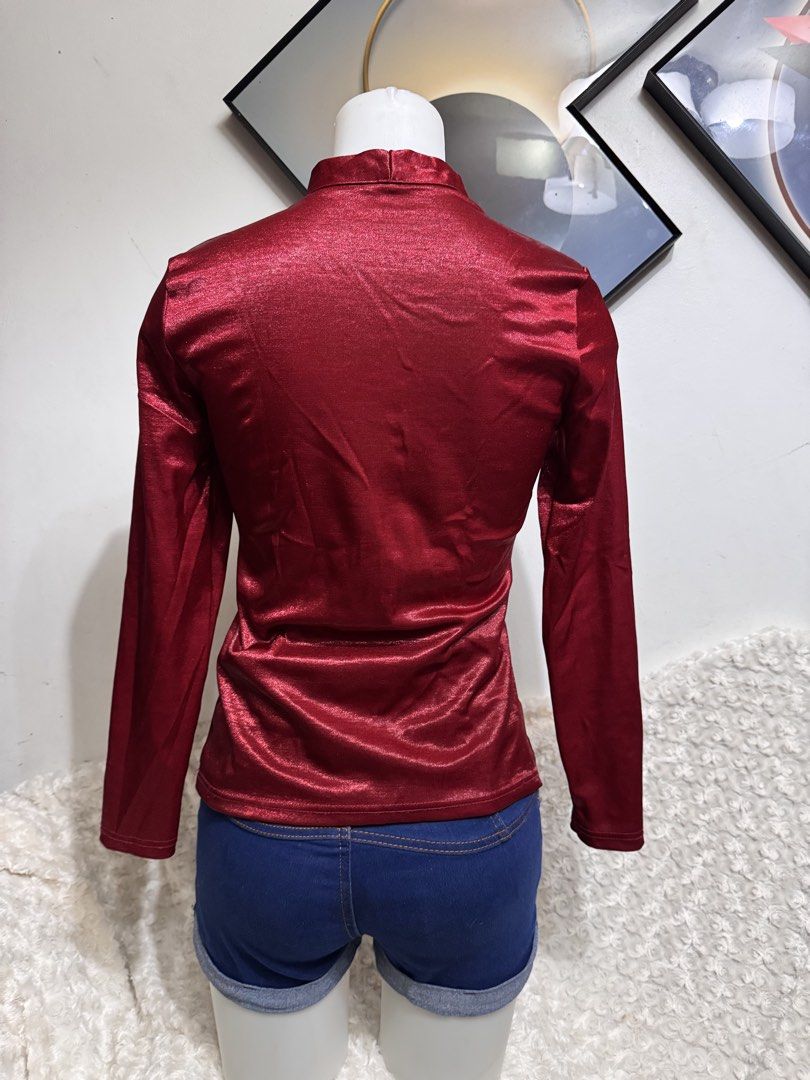 Shiny Red Long Sleeve Blouse with Button Detail (Category: Blouses) located in Marikina City. Submitted by lorradel (Listing ID 1462724805, Image 3). Description: - fits XS-S - Eye-catching red long sleeve blouse - Elegant mandarin collar - Three functional buttons down the front - Luxurious fabric with a subtle, shiny finish - Perfect for dressing up or down - Ideal for night outs or stylish daytime wear - Comfortable and chic design - MAY HAVE 