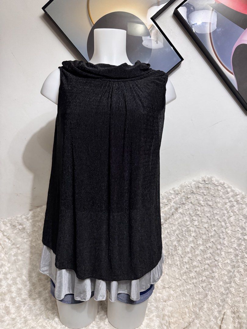 Sleeveless Cowl Neck (Category: Sleeveless) located in Marikina City. Submitted by lorradel (Listing ID 1462749680, Image 1). Description: Black sleeveless top with a cowl neck. It has a textured fabric and a flowy silhouette. The hem is layered with a sheer grey fabric. Great for dressing up or down. Easy to pair with skirts or pants. - MAY HAVE some washable stains (hindi maiiwasan) needs washing; had been stored - mannequin size 34-26-34 - man