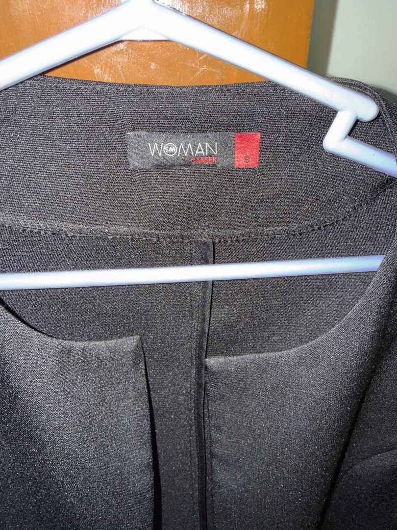 SM Woman Black Blazer Size S (Category: Coats, Jackets and Outerwear) located in Manila. Submitted by zealbear_602543 (Listing ID 1462837638, Image 2). Description: - Brand: SM Woman - Color: Black - Style: Collarless blazer - Neckline: Rounded - Features: Two front pockets, long sleeves - Versatility: Ideal for work or casual wear, easy to pair with any outfit.