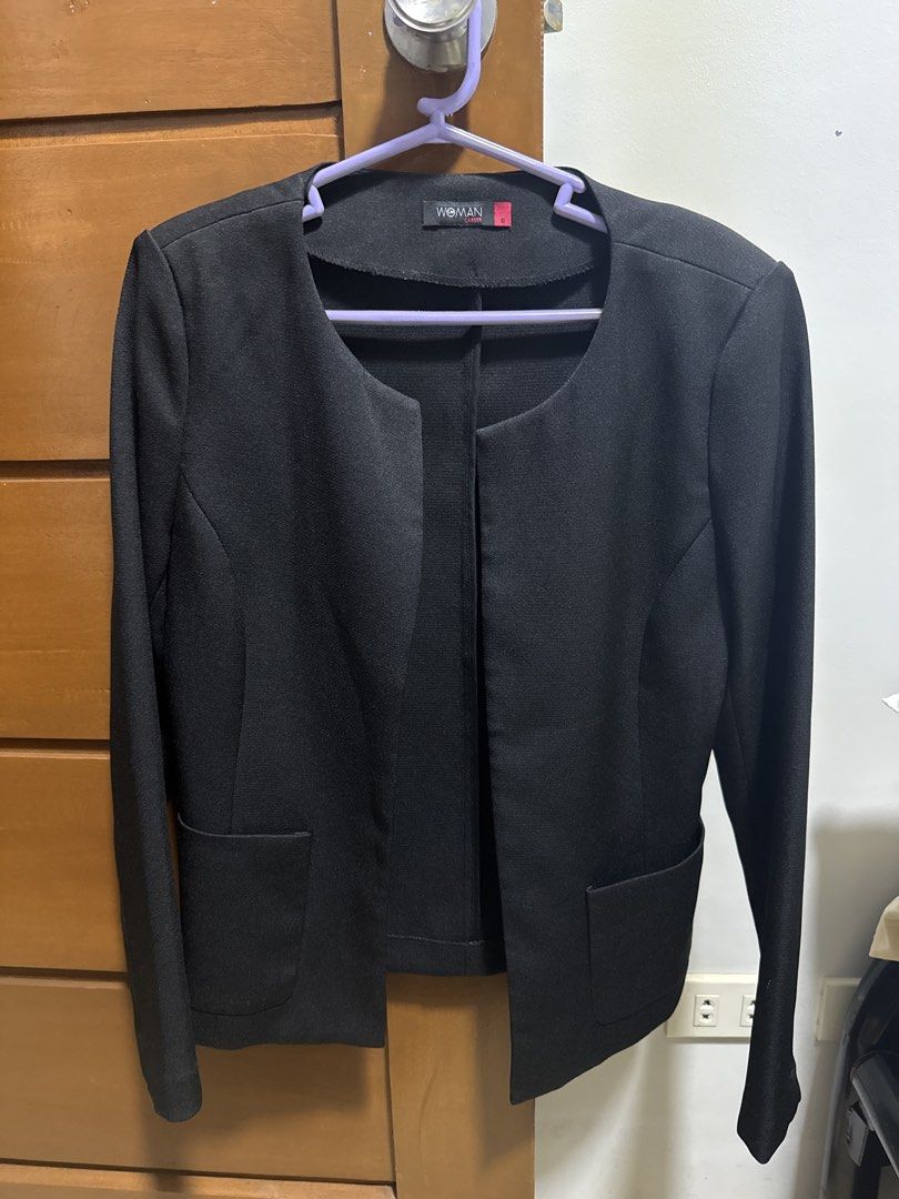 SM Woman Black Blazer Size S (Category: Coats, Jackets and Outerwear) located in Manila. Submitted by zealbear_602543 (Listing ID 1462837638, Image 1). Description: - Brand: SM Woman - Color: Black - Style: Collarless blazer - Neckline: Rounded - Features: Two front pockets, long sleeves - Versatility: Ideal for work or casual wear, easy to pair with any outfit.