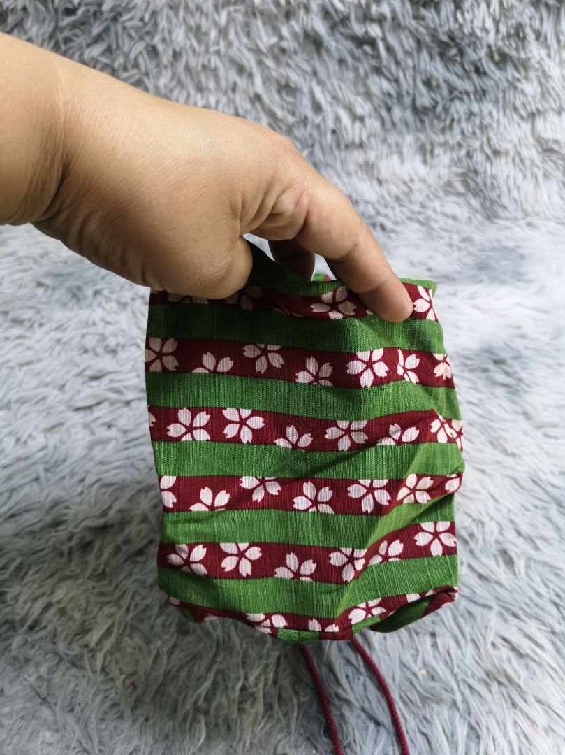 Small Green Striped With Floral Pattern Pouch (Category: Purses & Pouches) located in Santa Cruz. Submitted by jmy_surplus.2 (Listing ID 1462786784, Image 2). Description: Size ; L - 7.6 W - 10 Color ; Green Type ; Pouch Brand ; No brand Material ; Canvas Style ; Floral pattern Drawstring Pouch LR 129 JMY 5 Batch #222.