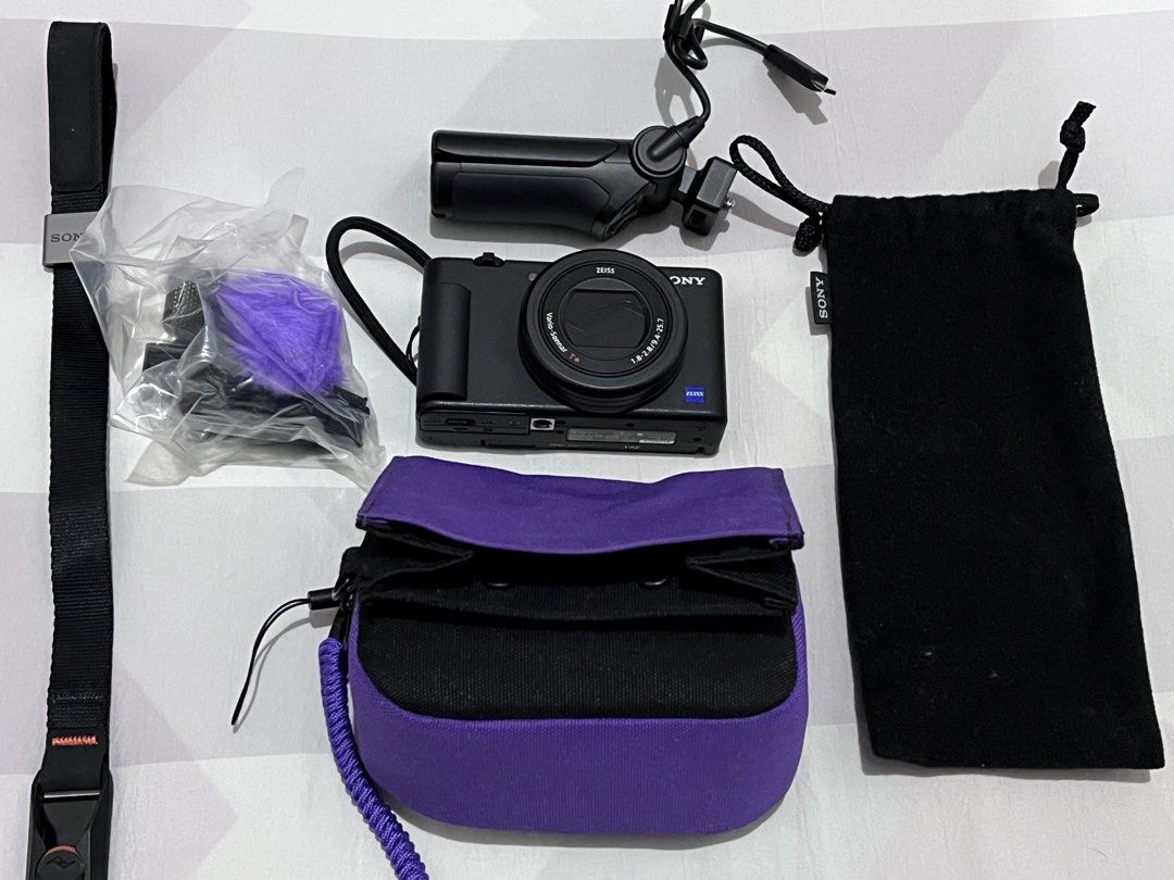 Sony ZV-1 Digital Camera with Accessories (Category: Cameras) located in Manila. Submitted by dk1997 (Listing ID 1462868148, Image 1). Description: Sony ZV-1 Camera Original price at 42,990 pesos. If you like vlogging, this camera is the best partner for it. - Shooting Grip - Wrist Strap - Purple Camera Pouch - Black Drawstring Pouch - Ideal for vlogging and everyday photography - All items in good, ready-to-use condition - Perfect bundle for con
