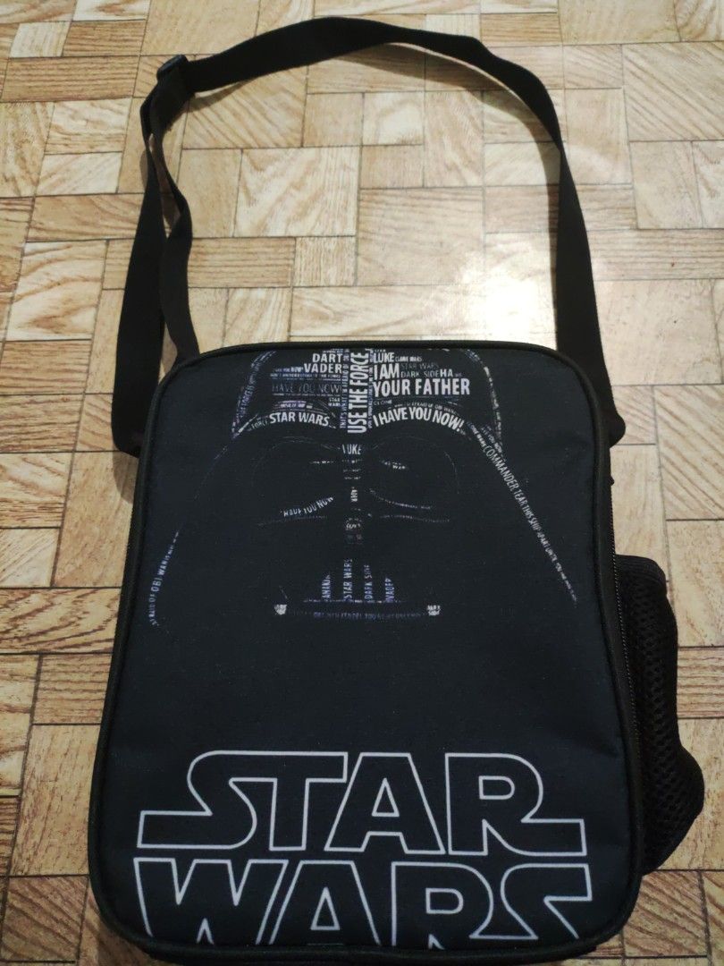 Star wars lunch bag (Category: Babies & Kids Fashion) located in Paranaque City. Submitted by jtaguirre (Listing ID 1462778895, Image 1). Description: - Stylish black lunch bag - Insulated grey interior to keep food cool - Convenient side mesh pocket - Secure zipper closure - Easy-to-carry top handles - Perfect for daily use and keeping meals fresh.
