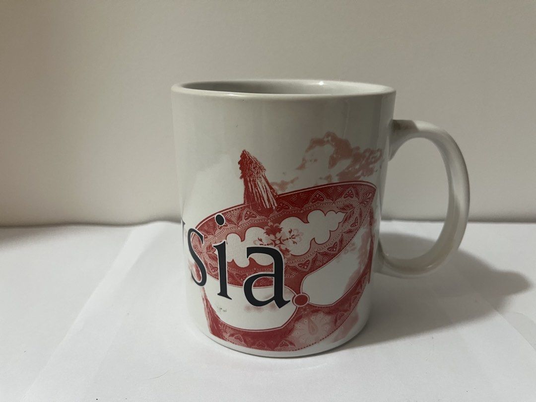 Starbucks Malaysia Mug (Category: Coffee & Tea Tableware) located in Pasig City. Submitted by st_03 (Listing ID 1462798391, Image 3). Description: - Authentic Starbucks mug from Malaysia. - Features a striking red and black marble-like pattern. - 'Malaysia' is clearly visible on the mug. - 'Starbucks' is written vertically on the handle. - Ideal for Starbucks collectors or daily beverage enjoyment. - Used for display only. - Just needs to be wash