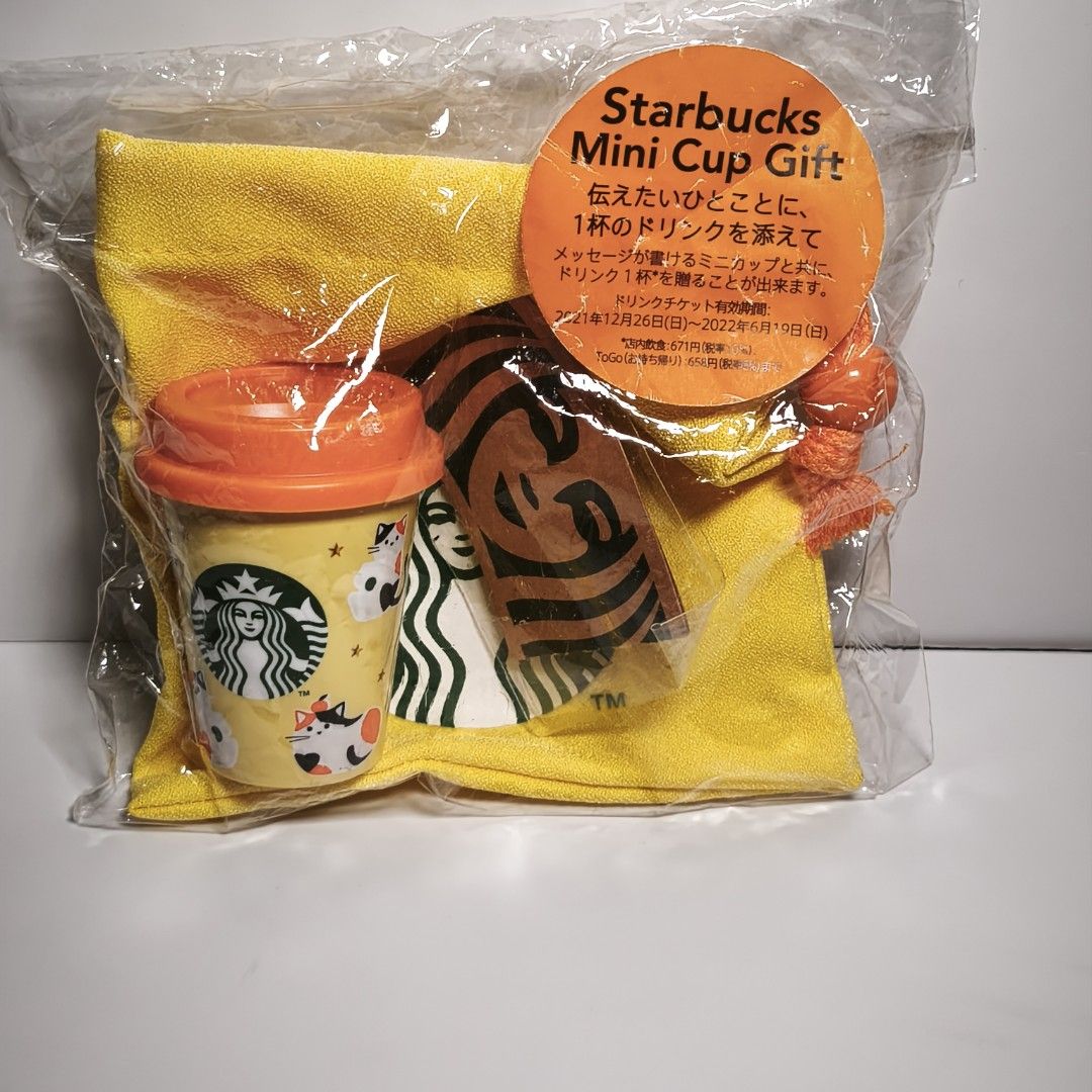 Starbucks Mini Cup Gift Set Cats 2021 (Category: Beverages) located in Manila. Submitted by abbey.lee (Listing ID 1462801211, Image 1). Description: - Starbucks Mini Cup Gift Set - Includes a cute mini cup with a cat design - Comes with a yellow cloth - Features a drink ticket valid from December 26, 2021 to June 19, 2022 - Ideal for gifting or personal collection.