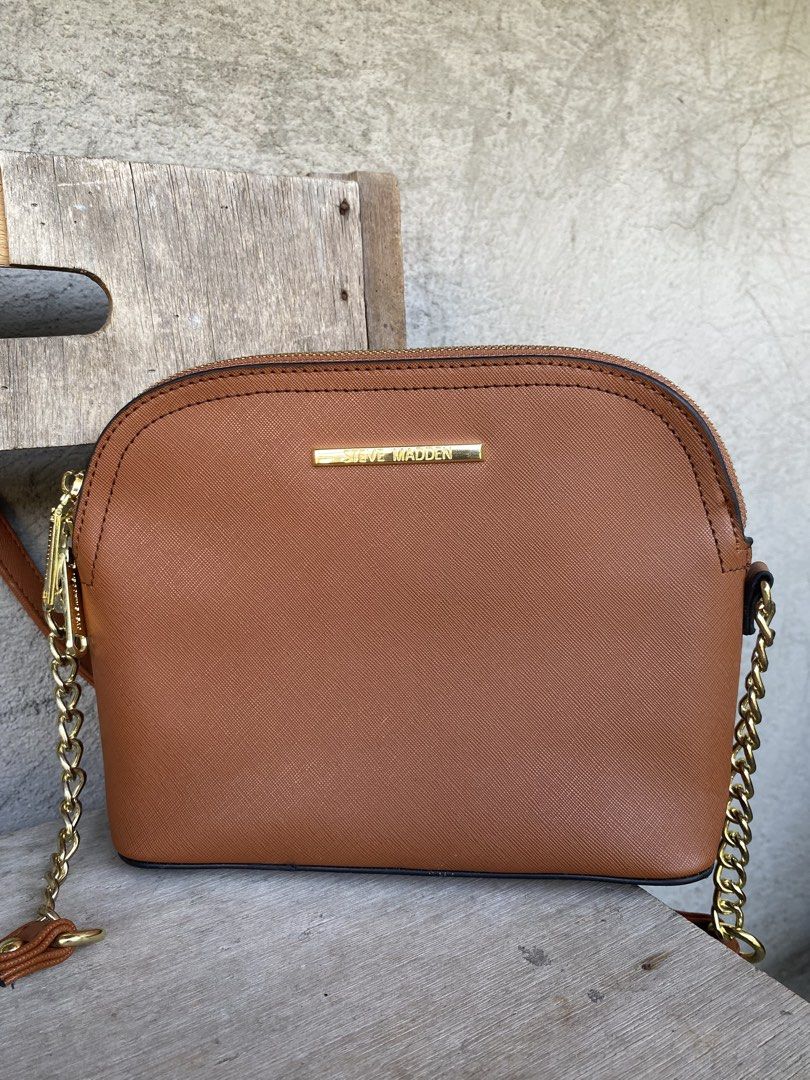 Steve Madden Long Strap Bag (Category: Cross-body Bags) located in Manila. Submitted by happy_leysantos (Listing ID 1462692712, Image 2). Description: Steve Madden Brown Crossbody Bag 🤎 ✨ Classic and stylish design ✨ Genuine Steve Madden ✨ Adjustable shoulder strap with chain detail ✨ Spacious enough for your everyday essentials ✨ Perfect for casual or semi-formal looks Condition: Good condition / lightly used Color: Brown/Cognac 🤎 PM me for mo