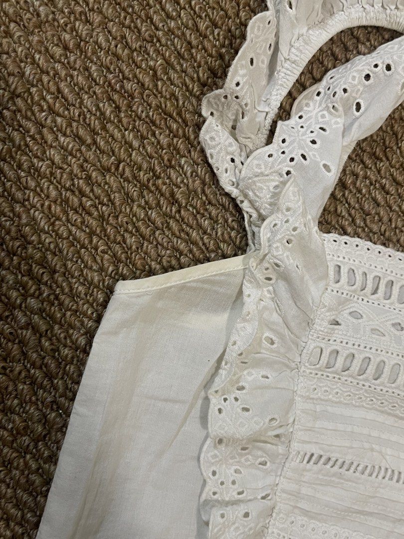 Stradivarius White Eyelet Ruffle Crop Top - XS (Category: Sleeveless) located in Pasig City. Submitted by miafml-closet-cleanout (Listing ID 1462743211, Image 3). Description: - stradivarius - size XS - flaw/s: yellowish discoloration sa underarm part (can be removed with bleach!) posted price is fixed ♡ will not respond to hagglers. 💵 mop: gcash / bdo / maribank / unionbank 🛵 courier: any as long as arranged by buyer 🙅🏻‍♀️ no requested worn 