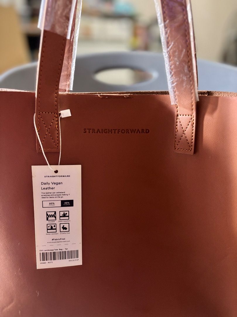 Straightforward Brown Leather Tote Bag (Category: Tote Bags) located in Manila. Submitted by blg.2026 (Listing ID 1462693041, Image 3). Description: Brown tote bag from Straightforward. Classic design, good size for daily use. Has the brand name embossed on the front. Comes with original tags. Never used..