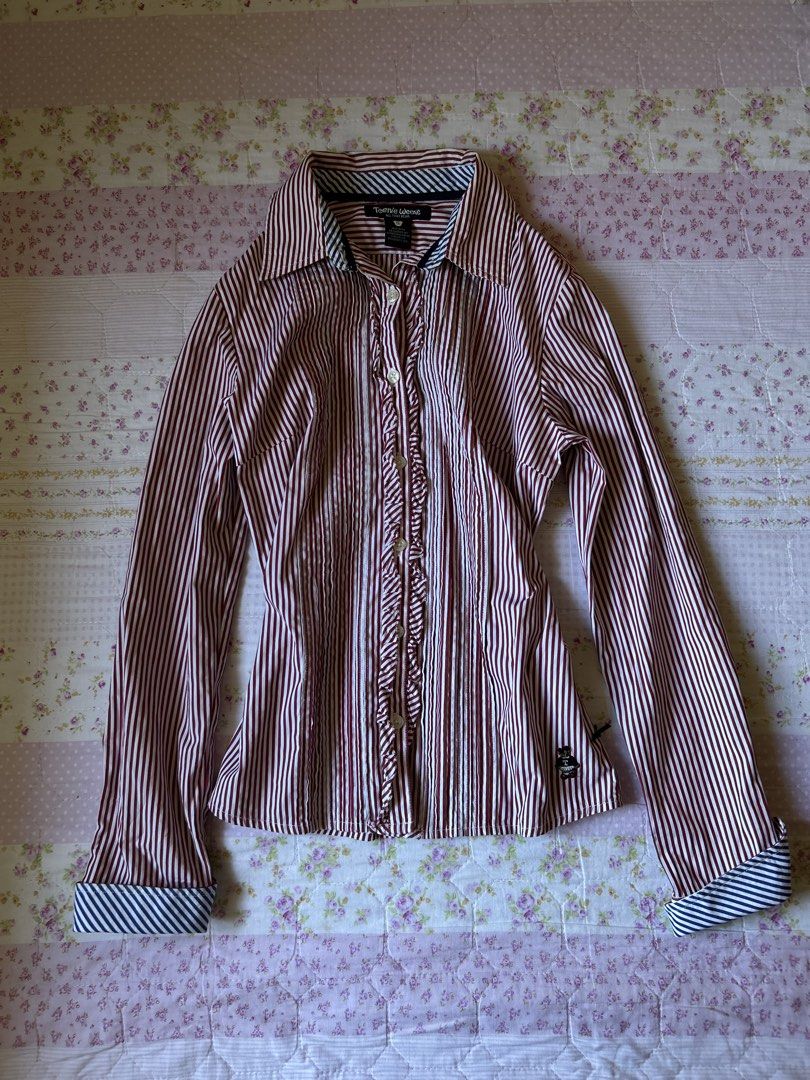 Striped Ruffle Button-Up Shirt (Category: Blouses) located in Cabanatuan. Submitted by j_preloved0012 (Listing ID 1462728673, Image 1). Description: - xs-m - Style: Button-up shirt - Color: Red and white stripes - Features: Ruffled front detail, button cuffs, cute bear logo on hem - Occasion: Great for casual or smart-casual wear.