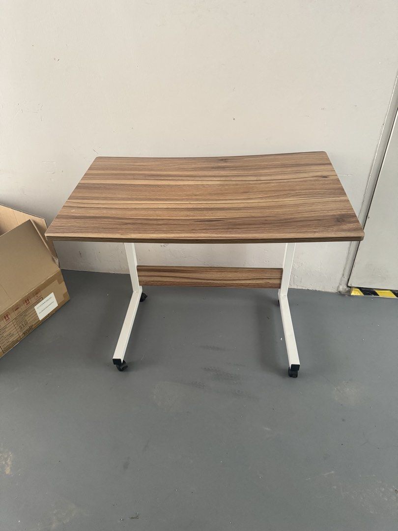 Study table with wheels (Category: Tables & Sets) located in Singapore. Submitted by bbg20245434 (Listing ID 1462800583, Image 1). Description: Self collect at Buangkok Adjustable height .