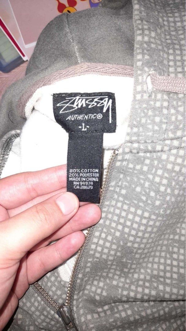 Stussy Authentic Zip-Up Hoodie Size L (Category: Hoodies) located in Manila. Submitted by truephoenix-a186 (Listing ID 1462764663, Image 2). Description: - Stussy Zip-Up Hoodie - Size: Large (L) - Design: Subtle all-over pattern - Material: 80% Cotton, 20% Polyester - Perfect for: Casual wear - Care Instructions: - Machine wash cold, inside out - Do not bleach - Tumble dry low - Do not iron on decoration.