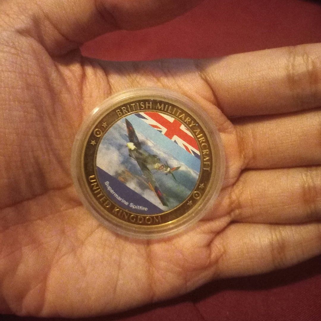 Supermarine Spitfire Commemorative Coin Medallion (Category: Currency) located in Imus. Submitted by mj.trinidad (Listing ID 1462596253, Image 3). Description: 1500. British Military Aircraft Supermarine Spitfire Commemorative Coin Medallion - Commemorative coin featuring the iconic Supermarine Spitfire. - Showcases British military aircraft and the United Kingdom. - One side: Spitfire in flight with the Union Jack. - Other side: Royal emblem (po