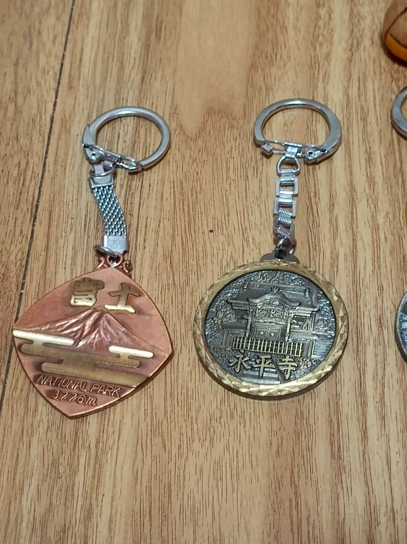 TAKE ALL 8 PCS KEYCHAIN (Category: Other Stationery & Craft) located in Makati City. Submitted by nyxhemera26 (Listing ID 1462861980, Image 3). Description: TAKE ALL 8 PCS KEYCHAIN - Features various travel-themed designs and landmarks - Includes keychains from Mt. Fuji, Noto Peninsula, and Expo '75 Okinawa - Ideal for collectors and personal use - Adds a unique touch to keys or bags.