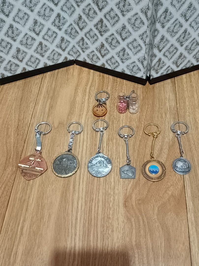 TAKE ALL 8 PCS KEYCHAIN (Category: Other Stationery & Craft) located in Makati City. Submitted by nyxhemera26 (Listing ID 1462861980, Image 1). Description: TAKE ALL 8 PCS KEYCHAIN - Features various travel-themed designs and landmarks - Includes keychains from Mt. Fuji, Noto Peninsula, and Expo '75 Okinawa - Ideal for collectors and personal use - Adds a unique touch to keys or bags.
