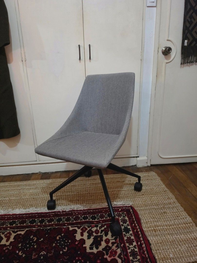 Task chair / office chair (Category: Chairs) located in Quezon City. Submitted by misspatchea (Listing ID 1462876835, Image 1). Description: NEGOTIABLE - Modern task chair in a versatile grey fabric. - Ergonomic design for comfort during long hours. - Smooth-rolling casters for easy mobility. - Ideal for home offices, study areas, or gaming setups. - Stylish and contemporary aesthetic. - Not reclining, height not adjustable also - Meetups availab