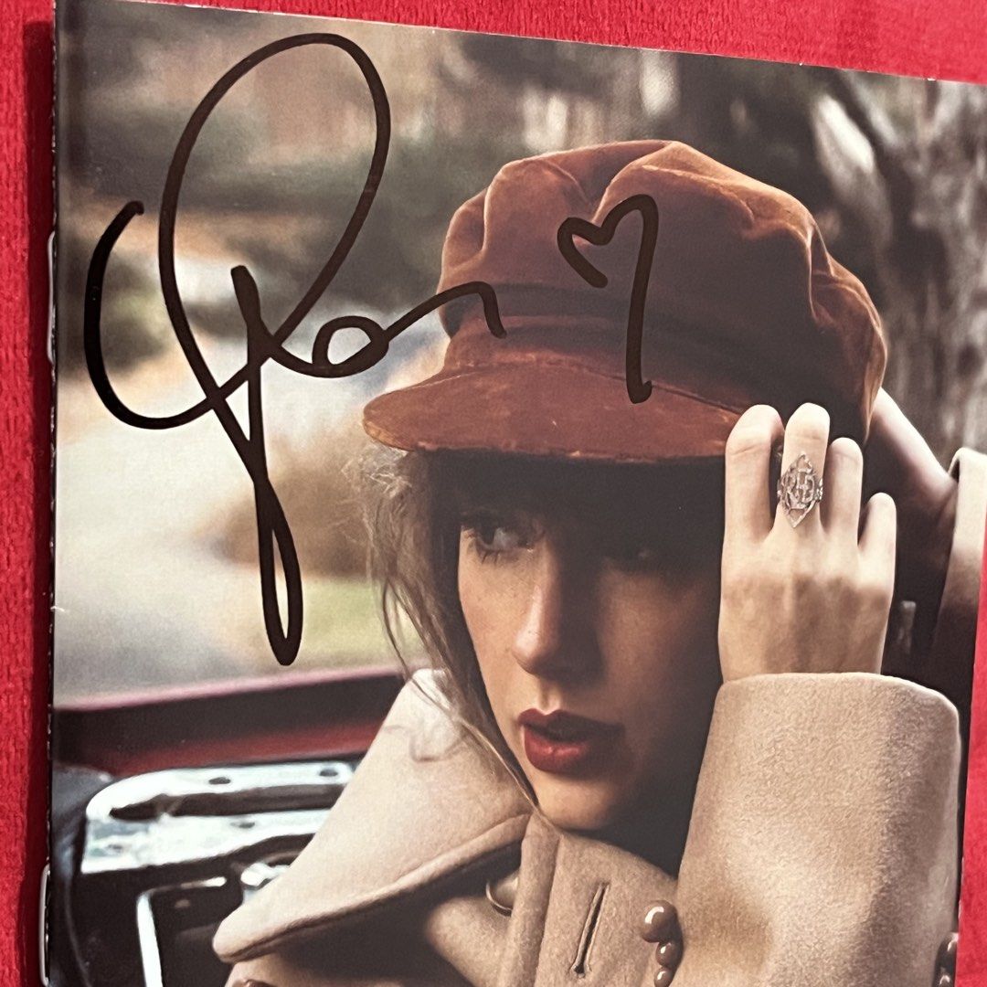 Taylor Swift Signed "Red (Taylor's Version)" CD (Category: CDs & DVDs) located in General Mariano Alvarez. Submitted by youngdog.93aa5a (Listing ID 1462781498, Image 2). Description: DM me your offer Unsealed but well kept - Signed copy of Taylor Swift's "Red (Taylor's Version)" CD. - Authentically autographed by Taylor Swift. - Perfect addition to any Swiftie's collection. - Features original album artwork on the case. - Own a piece of music his