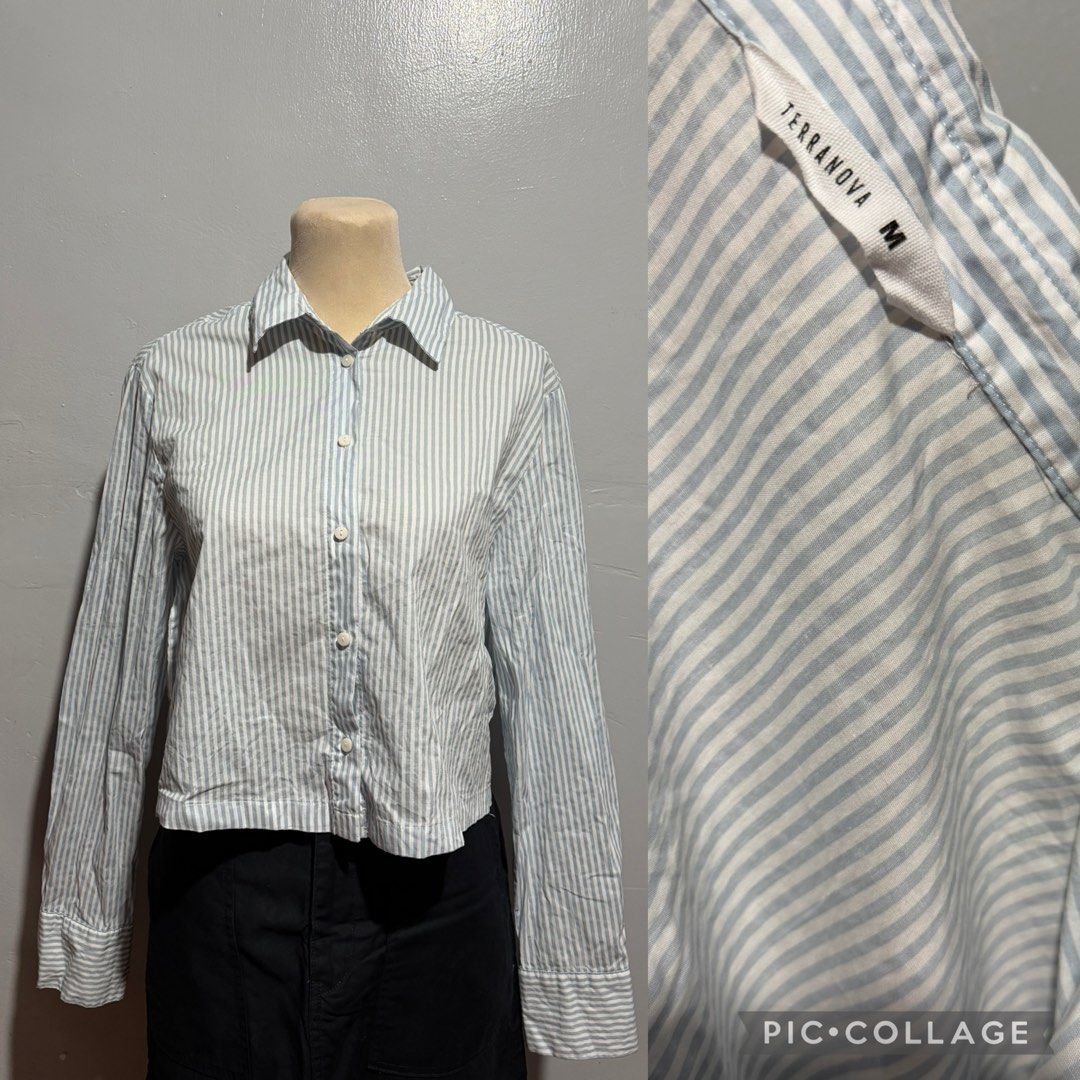 Terranova Striped Button-Up Shirt Size M (Category: Shirts) located in Malabon City. Submitted by annshopable_ (Listing ID 1462739724, Image 1). Description: - Terranova button-up shirt - Classic blue and white stripe pattern - Long sleeves with button cuffs - Cropped length - Perfect for pairing with high-waisted bottoms - Easy to style for casual or smart-casual looks - Ideal for everyday wear.