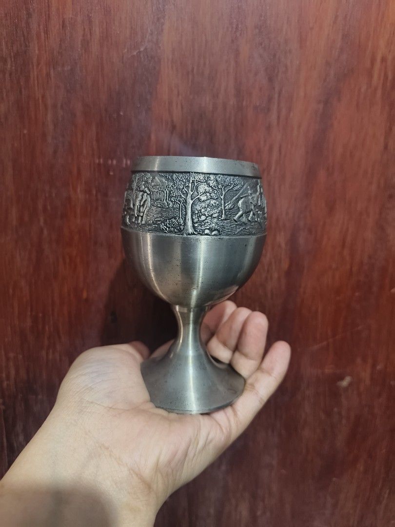 Thailand Pewter (Category: Vintage Collectibles) located in San Jose del Monte. Submitted by m_nshop (Listing ID 1462778204, Image 2). Description: - Unique metal goblet with intricate engraving. - Features detailed elephants and trees in a natural landscape. - Stands approximately 5 inches tall. - Perfect for display, as a unique drinking vessel, or a conversation starter. payment first jnt or lalamove courier.