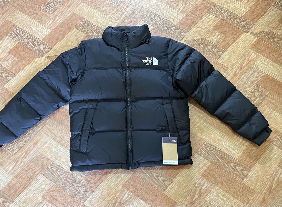 The North Face 700 Down Puffer Jacket Black (Category: Coats, Jackets and Outerwear) located in Manila. Submitted by thrift.zone1 (Listing ID 1462735927, Image 1). Description: - Brand: The North Face - Color: Black - Style: Puffer Jacket - Fill Power: 700 fill down for superior warmth - Features: Iconic TNF logo on chest and sleeve - Condition: Brand new with tag - Size: Small.