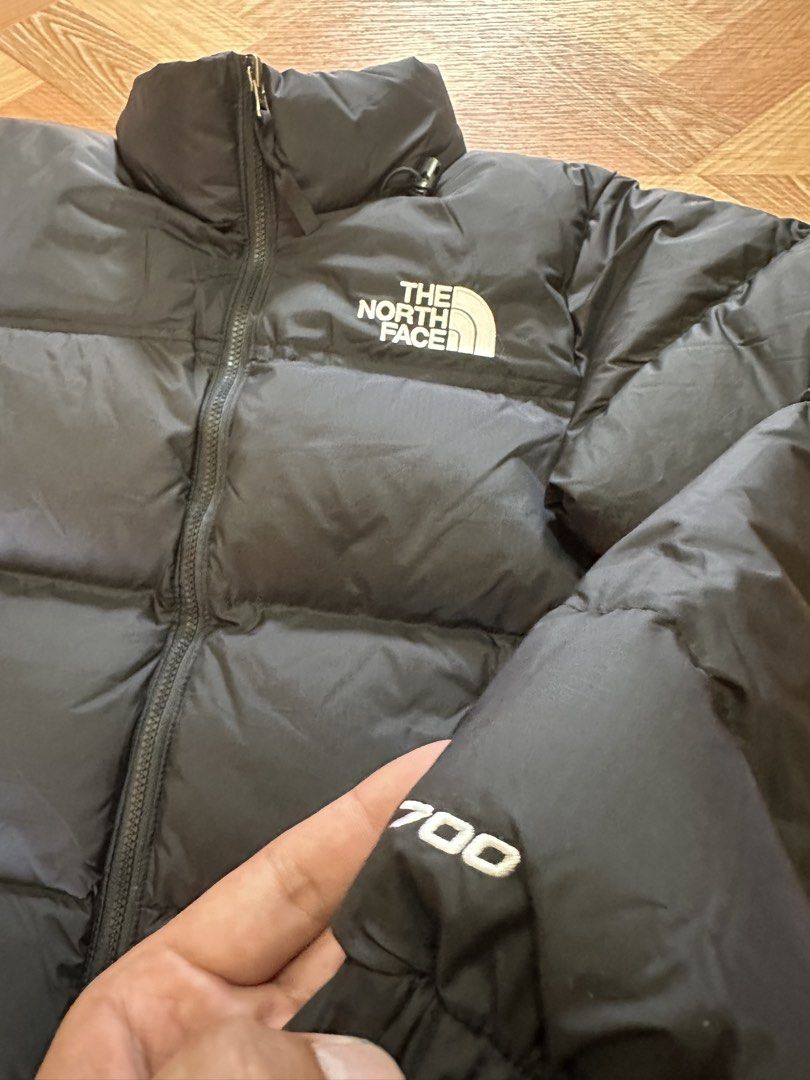 The North Face 700 Down Puffer Jacket Black (Category: Coats, Jackets and Outerwear) located in Manila. Submitted by thrift.zone1 (Listing ID 1462735927, Image 3). Description: - Brand: The North Face - Color: Black - Style: Puffer Jacket - Fill Power: 700 fill down for superior warmth - Features: Iconic TNF logo on chest and sleeve - Condition: Brand new with tag - Size: Small.