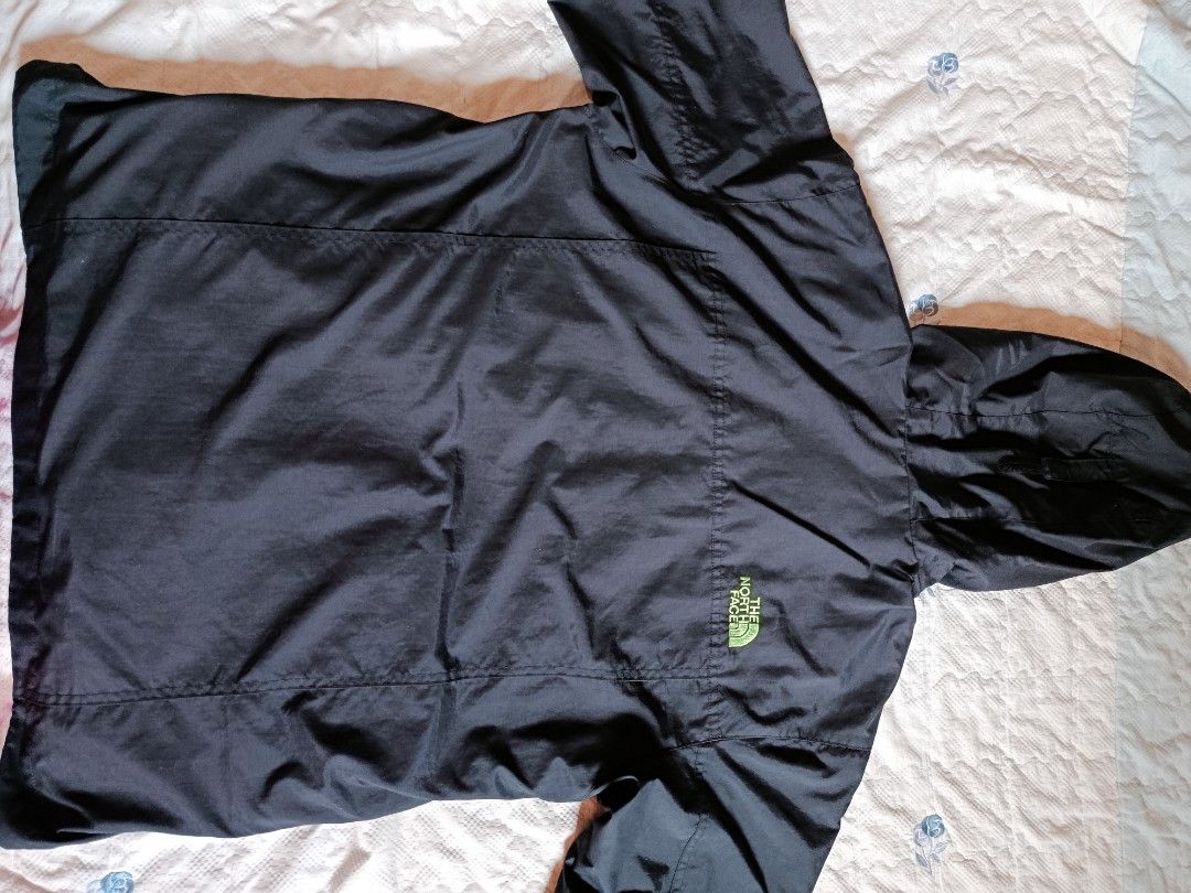 The North Face Black Jacket with Yellow Hood (Category: Coats, Jackets and Outerwear) located in Manila. Submitted by authentic.jaybee (Listing ID 1462728409, Image 2). Description: - Brand: The North Face - Color: Black - Hood Lining: Yellow - Pockets: 2 front zippered pockets, 1 chest zippered pocket - Logo: Subtle logo on the back - Size: Tagged 100 (L) - Ideal for: Outdoor activities.