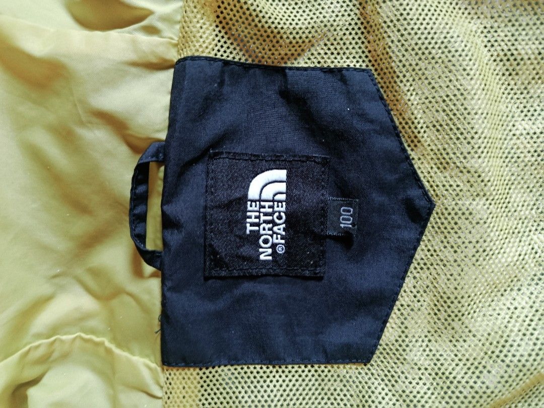 The North Face Black Jacket with Yellow Hood (Category: Coats, Jackets and Outerwear) located in Manila. Submitted by authentic.jaybee (Listing ID 1462728409, Image 3). Description: - Brand: The North Face - Color: Black - Hood Lining: Yellow - Pockets: 2 front zippered pockets, 1 chest zippered pocket - Logo: Subtle logo on the back - Size: Tagged 100 (L) - Ideal for: Outdoor activities.