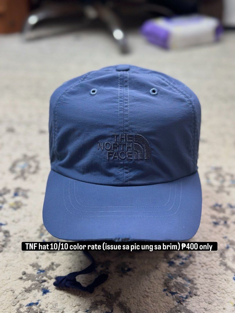 The North Face Blue Cap (Category: Caps & Hats) located in Daet. Submitted by thrifthings2018 (Listing ID 1462760876, Image 1). Description: - Blue The North Face cap - Embroidered TNF logo on front - Adjustable strap at the back - Note: There is a tear on the brim (visible in the last photo) - Price: P400.