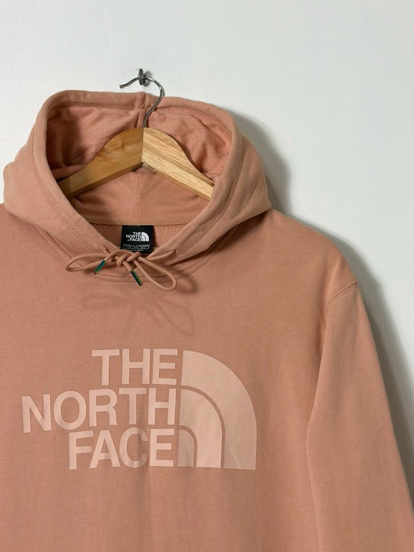 THE NORTH FACE DREW PEAK PULLOVER HOODIE (Category: Coats, Jackets and Outerwear) located in Cavite. Submitted by frankiemnla (Listing ID 1462879025, Image 3). Description: L- 27 W- 22 Size- M to L Design: Features a classic pullover silhouette with a prominent, tone-on-tone screen-printed logo across the chest. Colorway: A muted, earthy pastel shade commonly referred to by the brand as Pink Clay. Functionality: Comes equipped with an adjustable 