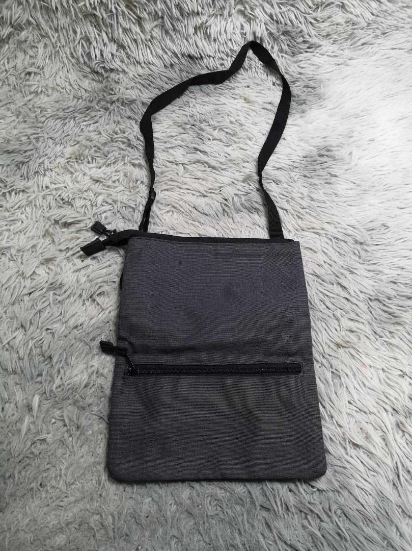 Thin Black Adjustable Strap Sling Bag (Category: Sling Bags) located in Santa Cruz. Submitted by jmy_surplus.2 (Listing ID 1462704614, Image 3). Description: Size ; L - 11.4 W - 9.4 Color ; Black Type ; Sling Bag Brand ; No brand Material ; Nylon Style ; Black Sling Bag LR 129 JMY 5 Batch #222.