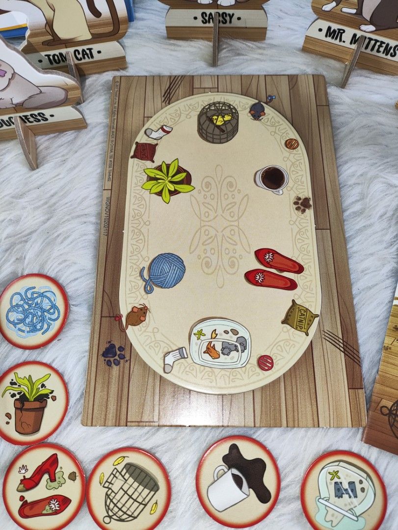ThinkFun Cat Crimes Logic Game (Category: Board Games & Puzzles) located in Cavite. Submitted by tinetaclesss (Listing ID 1462696076, Image 2). Description: - ThinkFun Cat Crimes logic game - Includes: game board, 6 cat tokens with stands, 40 challenge cards - Perfect for solo play and developing problem-solving skills - Recommended for ages 8 to adult.