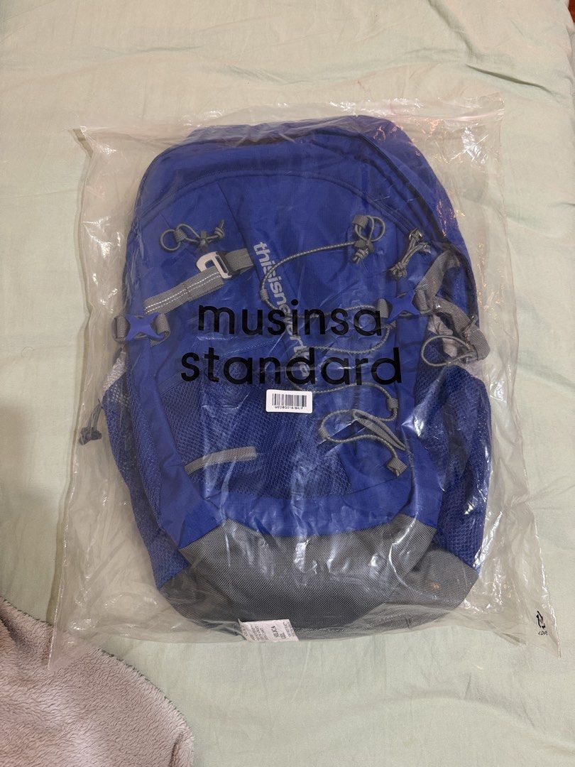 thisisneverthat Backpack (Category: Backpacks) located in Singapore. Submitted by samagksan (Listing ID 1461618060, Image 7). Description: - Brand: thisisneverthat - Color: Blue - Features: Multiple pockets for organization - Side Pockets: Mesh - Front Compartment: Zip closure - Reflective Details: On cords and straps - Ideal for: School, day trips.