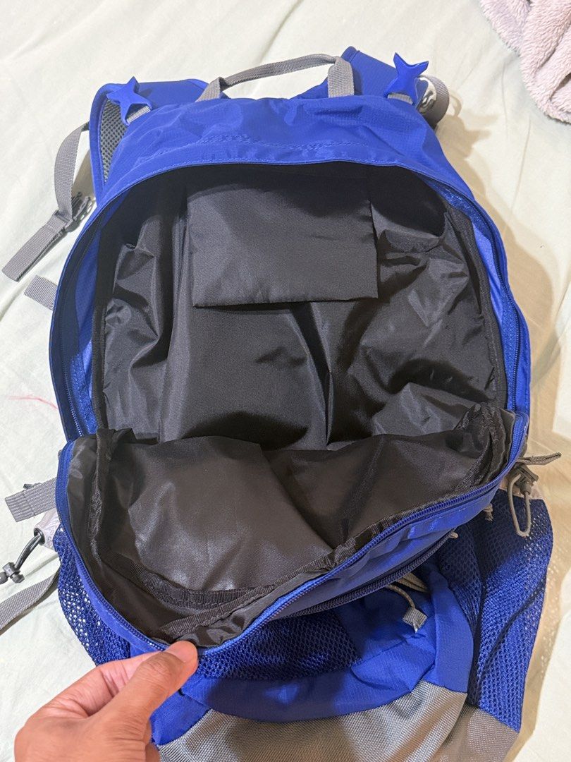 thisisneverthat Backpack (Category: Backpacks) located in Singapore. Submitted by samagksan (Listing ID 1461618060, Image 5). Description: - Brand: thisisneverthat - Color: Blue - Features: Multiple pockets for organization - Side Pockets: Mesh - Front Compartment: Zip closure - Reflective Details: On cords and straps - Ideal for: School, day trips.