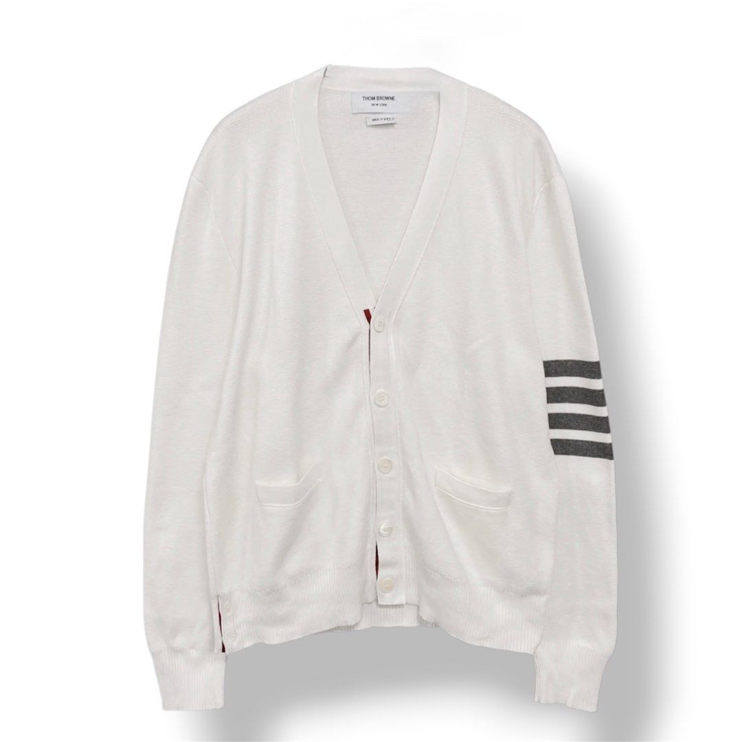 Thom Browne White 4-Bar Stripe Cardigan (Category: Luxury Apparel) located in Cabuyao City. Submitted by 0ld_souls (Listing ID 1462864325, Image 1). Description: - Classic white Thom Browne cardigan - Signature 4-bar stripe detail on left sleeve - Button-up front - Two front pockets - Made in Italy - Ideal for layering.