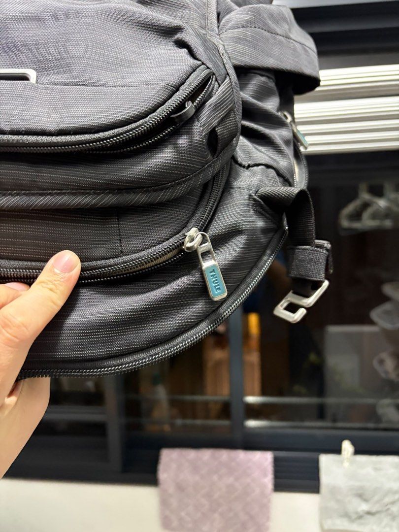 Thule Construct Backpack 24L (Category: Backpacks) located in Singapore. Submitted by leexlss (Listing ID 1462772968, Image 4). Description: • Condition: Well used • 24L capacity • Fits laptop up to 15.6” • Multiple compartments for laptop, tablet & daily essentials • Side pockets for water bottle • Luggage pass-through strap – convenient for travel • Comfortable padded back panel • Durable and practical for everyday use Well used with normal sig