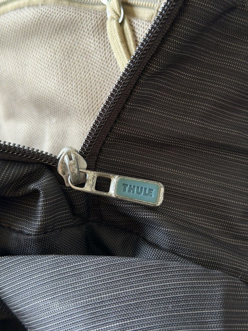 Thule Construct Backpack 24L (Category: Backpacks) located in Singapore. Submitted by leexlss (Listing ID 1462772968, Image 7). Description: • Condition: Well used • 24L capacity • Fits laptop up to 15.6” • Multiple compartments for laptop, tablet & daily essentials • Side pockets for water bottle • Luggage pass-through strap – convenient for travel • Comfortable padded back panel • Durable and practical for everyday use Well used with normal sig