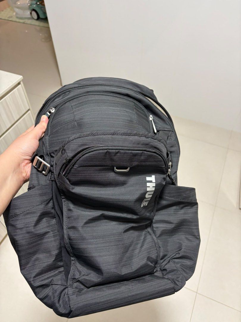 Thule Construct Backpack 24L (Category: Backpacks) located in Singapore. Submitted by leexlss (Listing ID 1462772968, Image 1). Description: • Condition: Well used • 24L capacity • Fits laptop up to 15.6” • Multiple compartments for laptop, tablet & daily essentials • Side pockets for water bottle • Luggage pass-through strap – convenient for travel • Comfortable padded back panel • Durable and practical for everyday use Well used with normal sig