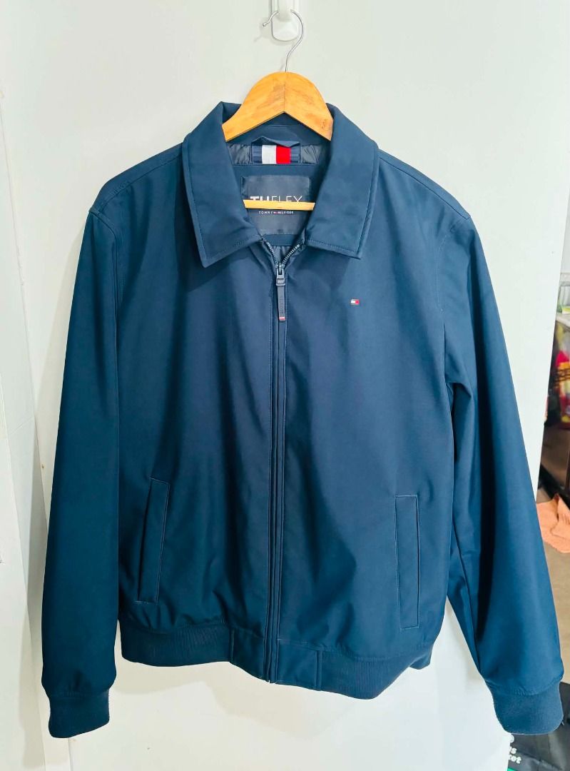 Tommy Hilfiger The Flex Jacket Navy Blue (Category: Coats, Jackets and Outerwear) located in Caloocan City. Submitted by capurcosjo05601 (Listing ID 1462699871, Image 1). Description: - Classic navy blue Tommy Hilfiger jacket - Part of the Flex line for added stretch - Features a zip-up front - Includes convenient pockets - Ribbed cuffs and hem for a comfortable fit - Perfect for layering or wearing solo - Easy to style for any occasion.