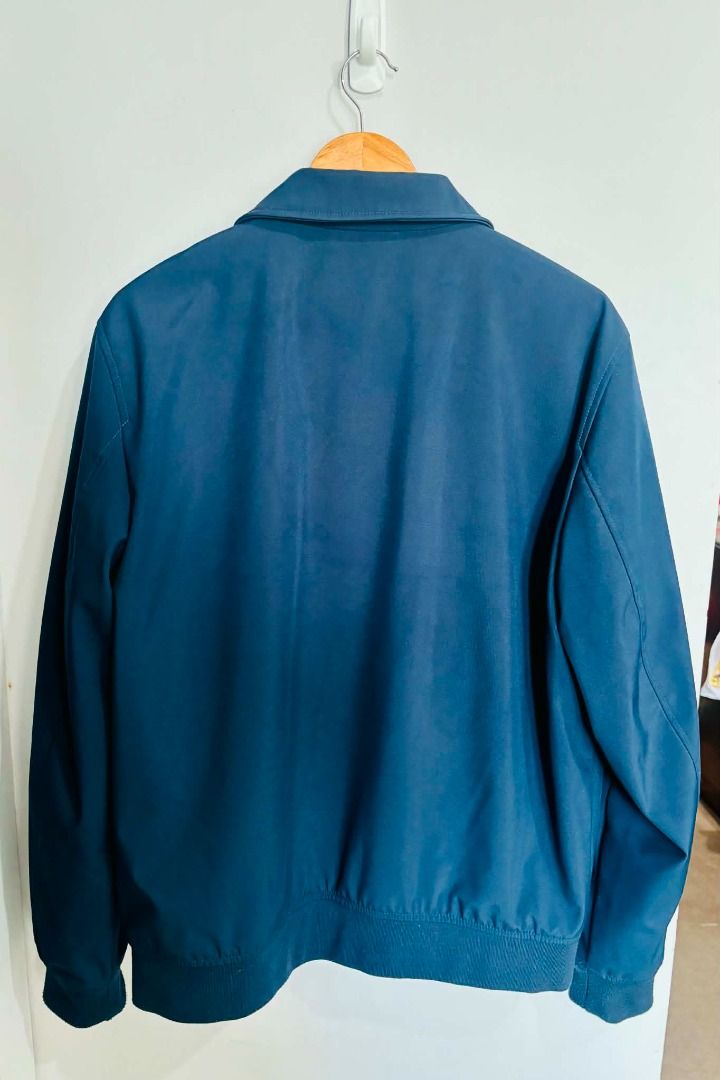 Tommy Hilfiger The Flex Jacket Navy Blue (Category: Coats, Jackets and Outerwear) located in Caloocan City. Submitted by capurcosjo05601 (Listing ID 1462699871, Image 2). Description: - Classic navy blue Tommy Hilfiger jacket - Part of the Flex line for added stretch - Features a zip-up front - Includes convenient pockets - Ribbed cuffs and hem for a comfortable fit - Perfect for layering or wearing solo - Easy to style for any occasion.