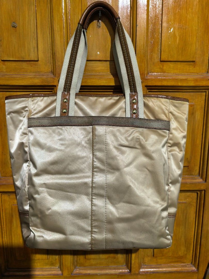 Tote bag (Category: Shoulder Bags) located in Manila. Submitted by khulet2008 (Listing ID 1462875681, Image 2). Description: C-o-A-c-H baby bag/diaper bag or school bag Spacious. With flaws, discoloration . Nylon material. Clean inside. With intact creed. Washable. Good for everyday errands..
