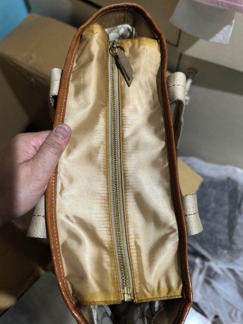 Tote bag (Category: Shoulder Bags) located in Manila. Submitted by khulet2008 (Listing ID 1462875681, Image 3). Description: C-o-A-c-H baby bag/diaper bag or school bag Spacious. With flaws, discoloration . Nylon material. Clean inside. With intact creed. Washable. Good for everyday errands..