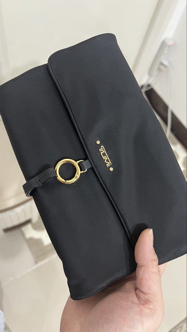 Tumi nylon jewelry organizer (Category: Luxury Bags & Wallets) located in Cainta. Submitted by katchers (Listing ID 1462880457, Image 1). Description: - Tumi monogram jacquard organizer pouch - Organizer features multiple compartments for jewelry and accessories - Ideal for travel or everyday use.