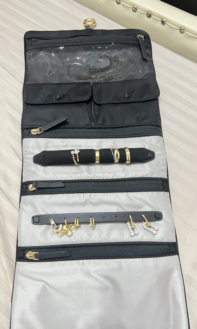 Tumi nylon jewelry organizer (Category: Luxury Bags & Wallets) located in Cainta. Submitted by katchers (Listing ID 1462880457, Image 3). Description: - Tumi monogram jacquard organizer pouch - Organizer features multiple compartments for jewelry and accessories - Ideal for travel or everyday use.
