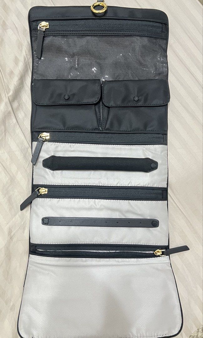 Tumi nylon jewelry organizer (Category: Luxury Bags & Wallets) located in Cainta. Submitted by katchers (Listing ID 1462880457, Image 2). Description: - Tumi monogram jacquard organizer pouch - Organizer features multiple compartments for jewelry and accessories - Ideal for travel or everyday use.