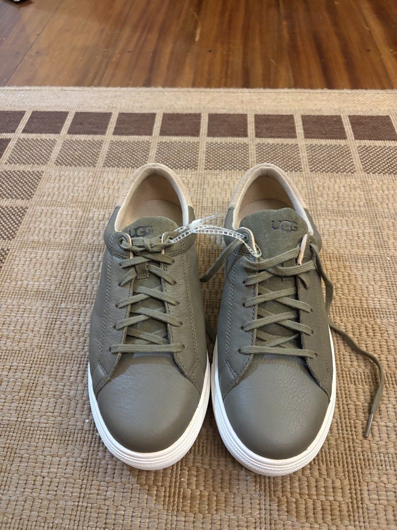 UGG Leather Sneakers - Olive Green (Category: Sneakers) located in Paranaque City. Submitted by max_bully014 (Listing ID 1462834717, Image 2). Description: - Olive green UGG sneakers - Genuine leather upper - Classic lace-up design - Comfortable inner lining - Durable white rubber sole - UGG logo on tongue, insole, and sole - Ideal for casual, everyday wear.