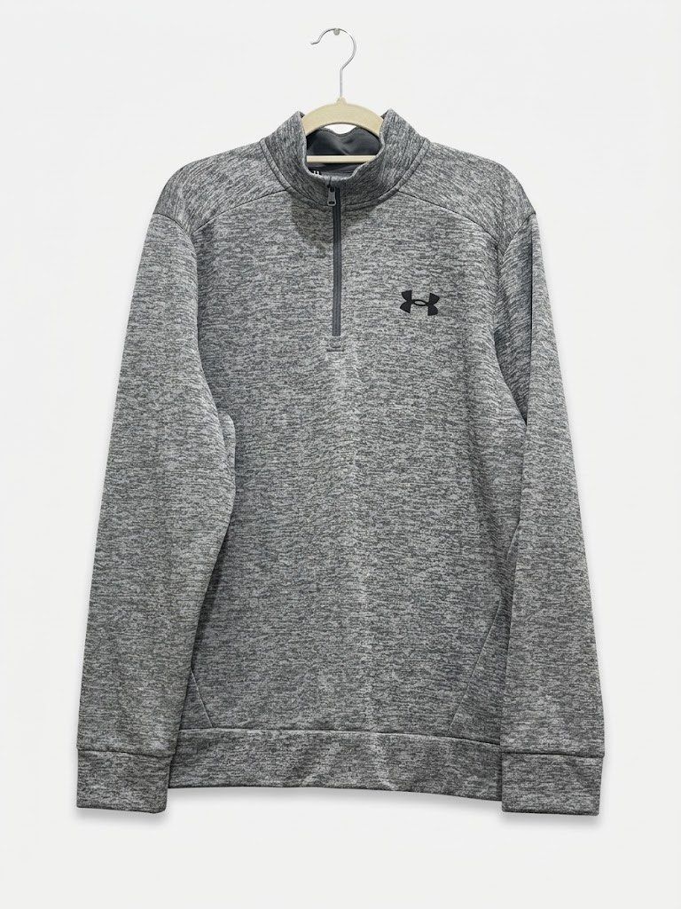 Under Armour Grey Heather 1/4 Zip Sweatshirt MD/M (Category: Coats, Jackets and Outerwear) located in Quezon City. Submitted by heyhaveaniceday (Listing ID 1462829999, Image 1). Description: - Grey heathered Under Armour sweatshirt - Size: Medium (M) - Fit: Loose - Features: 1/4 zip neckline, small black Under Armour logo on chest - Made in: Jordan From US.